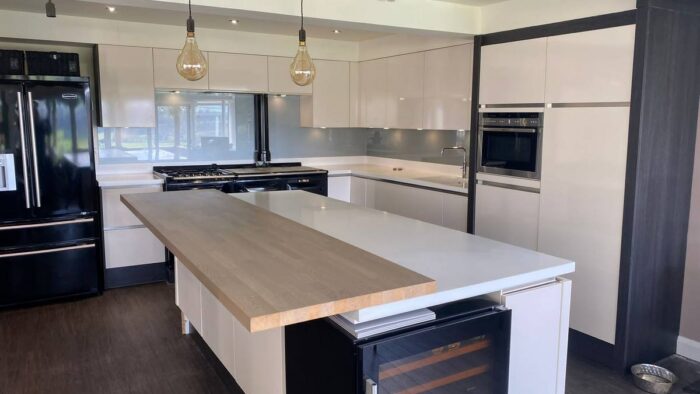 Large Modern Light Buttercream Gloss Kitchen & Island Neff Quooker Appliances White Corian Worktops