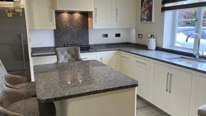 Buttercream Chrome Handled Dovetail Joint Kitchen with Island and Utility Room – Siemens Appliances - Grey Flecked Granite Worktops