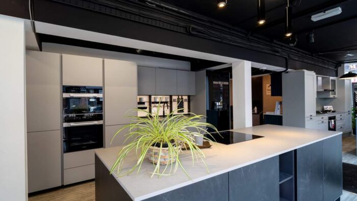 Ex Display Next 125 Premium Ceramic and SensiQ Door Kitchen with Island – Miele AEG Appliances – Raw Concrete Caesarstone Worktops
