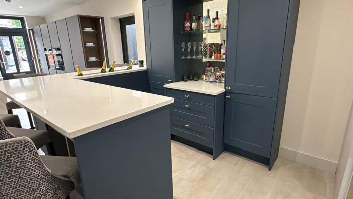 Navy Shaker Style with Gold Handled Bar Area including Antique Mirror including Stainless Steel Champagne Sink - Fugen White Shimmer Quartz Worktops